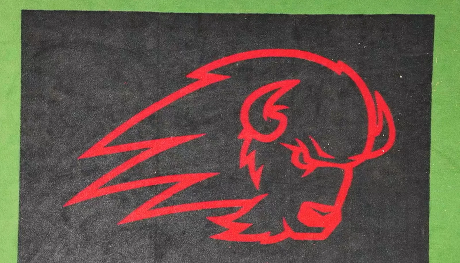 Black turf mat with the red Utah Tech Trailblazer logo